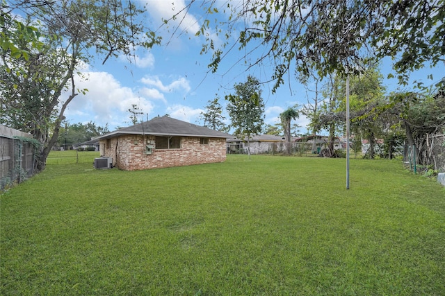 view of yard featuring central AC