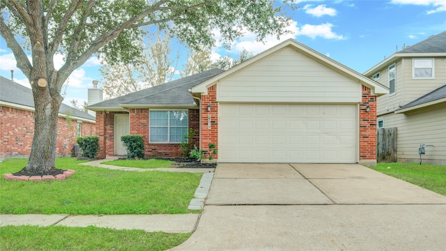 view of front of home with a front lawn and a garage