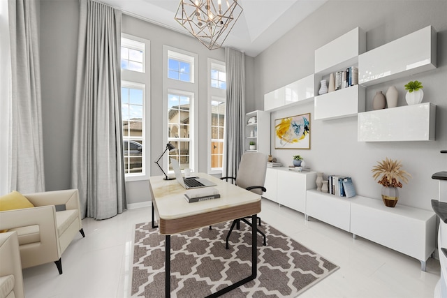 office space featuring a chandelier and light tile patterned floors