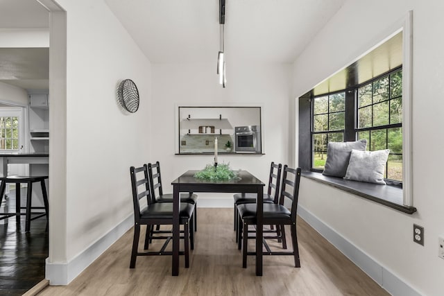 dining area featuring hardwood / wood-style flooring