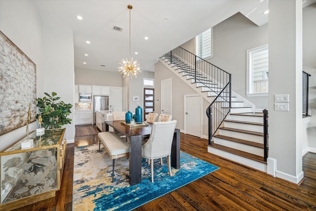 309 W Pierce St, Houston, TX 77019 - dining area with stairs, dark wood finished floors, healthy amount of natural light, baseboards, and recessed lighting