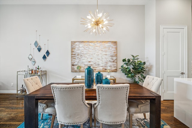 dining room featuring dark wood-type flooring and a chandelier