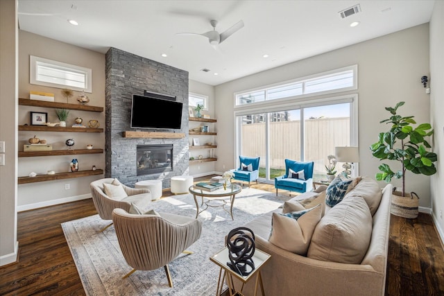 309 W Pierce St, Houston, TX 77019 - living room with ceiling fan, dark wood-style flooring, a stone fireplace, baseboards, and recessed lighting