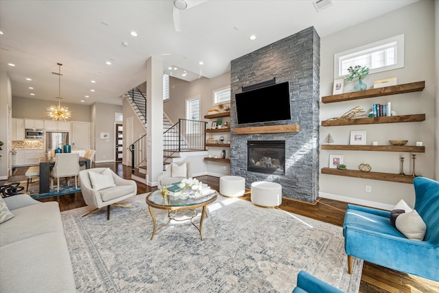 living room featuring hardwood / wood-style flooring, a healthy amount of sunlight, and a fireplace