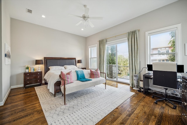 bedroom featuring ceiling fan, dark hardwood / wood-style floors, and access to exterior