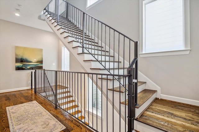309 W Pierce St, Houston, TX 77019 - stairway with wood finished floors, baseboards, and recessed lighting