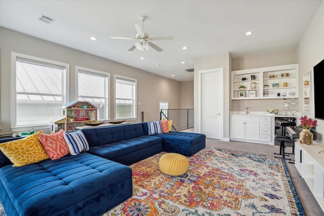 309 W Pierce St, Houston, TX 77019 - living room featuring a ceiling fan, bar with sink, and recessed lighting