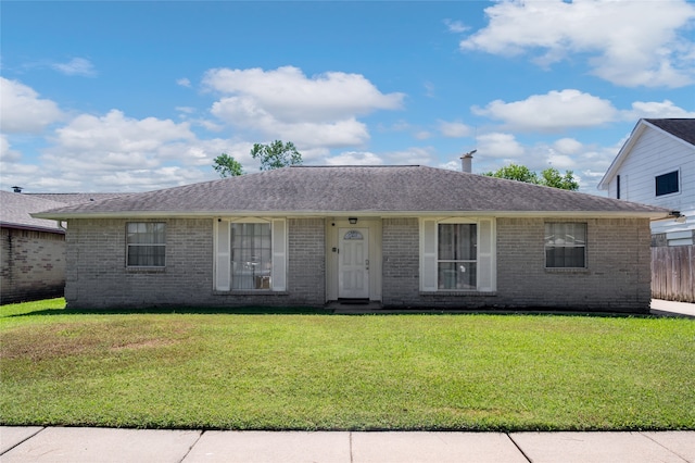 ranch-style house with a front lawn