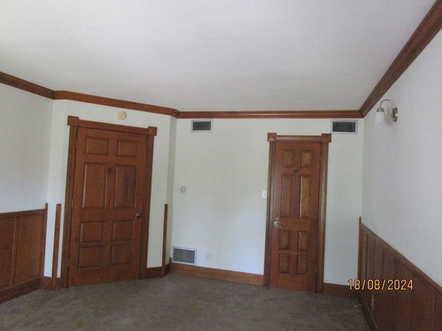 carpeted spare room with ornamental molding