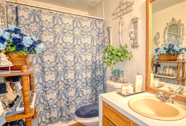 bathroom with vanity and toilet