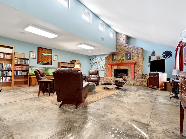 living room with a fireplace and concrete flooring