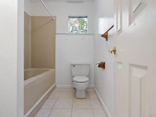 bathroom with walk in shower, tile patterned flooring, and toilet