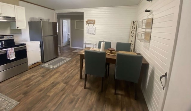 dining space with dark hardwood / wood-style flooring