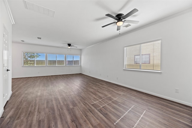 unfurnished room with dark hardwood / wood-style flooring, ceiling fan, and crown molding