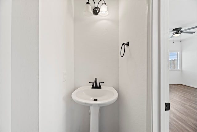 bathroom featuring hardwood / wood-style flooring and ceiling fan