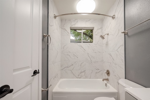 full bathroom featuring vanity, toilet, and tiled shower / bath combo