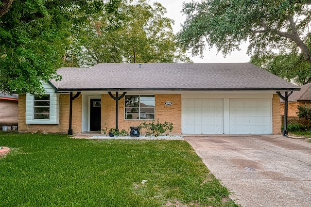 single story home with a garage and a front yard