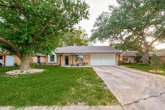 ranch-style home with a garage and a front lawn