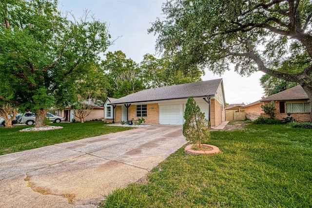 ranch-style home with a garage and a front lawn