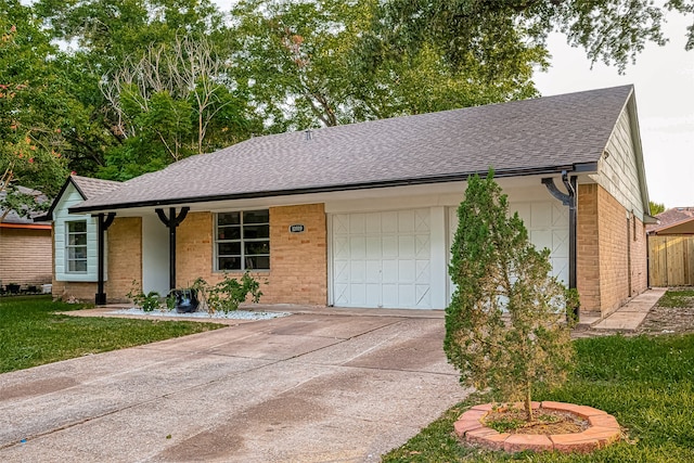 ranch-style home featuring a garage