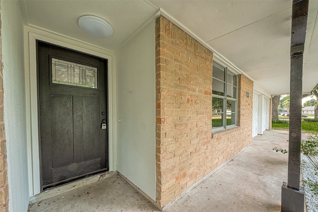 doorway to property featuring a porch