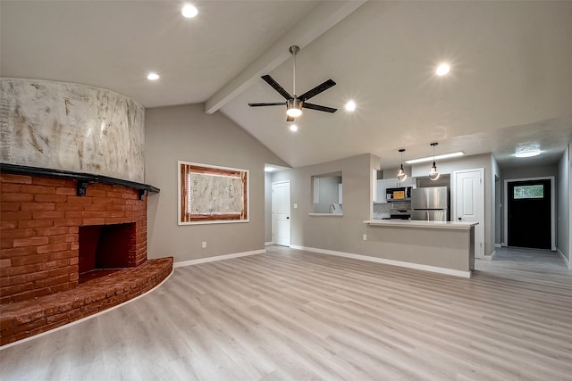 unfurnished living room featuring a fireplace, ceiling fan, light wood-type flooring, and vaulted ceiling with beams