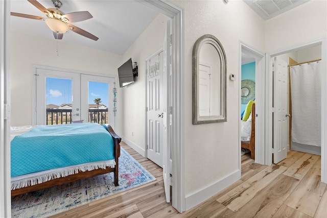 bedroom featuring access to outside, light wood-type flooring, french doors, and ceiling fan