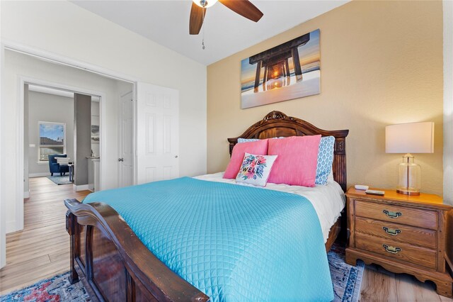 2423 Sandpiper, Crystal Beach, TX 77650 - bedroom featuring wood finished floors, baseboards, and a ceiling fan