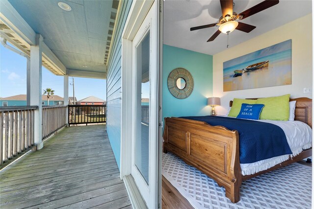 2423 Sandpiper, Crystal Beach, TX 77650 - bedroom featuring wood finished floors, access to outside, and ceiling fan