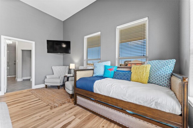 2423 Sandpiper, Crystal Beach, TX 77650 - bedroom with wood finished floors, baseboards, and lofted ceiling