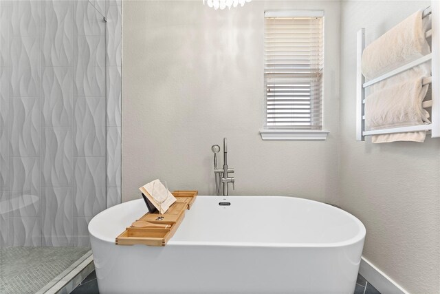 2423 Sandpiper, Crystal Beach, TX 77650 - bathroom with a tile shower and a freestanding tub