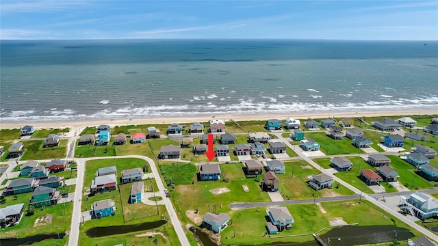 bird's eye view with a view of the beach and a water view