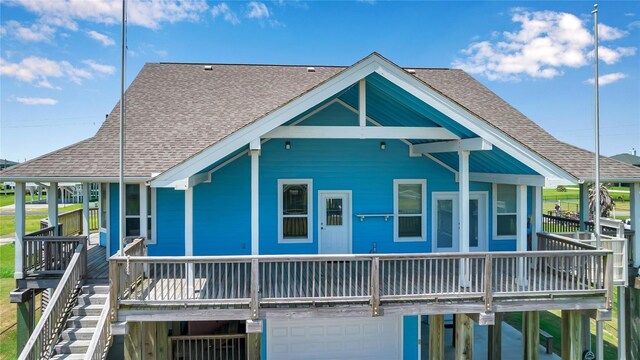 2423 Sandpiper, Crystal Beach, TX 77650 - back of property featuring roof with shingles and a garage