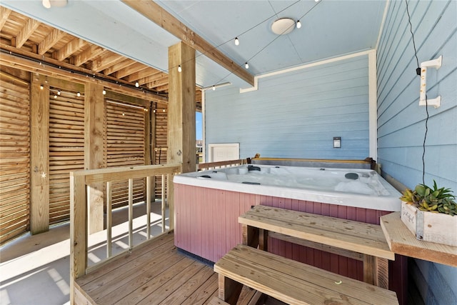 wooden deck featuring a hot tub