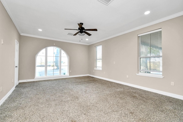 unfurnished room featuring a wealth of natural light, ceiling fan, and carpet