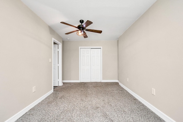 unfurnished bedroom featuring carpet floors, a closet, and ceiling fan