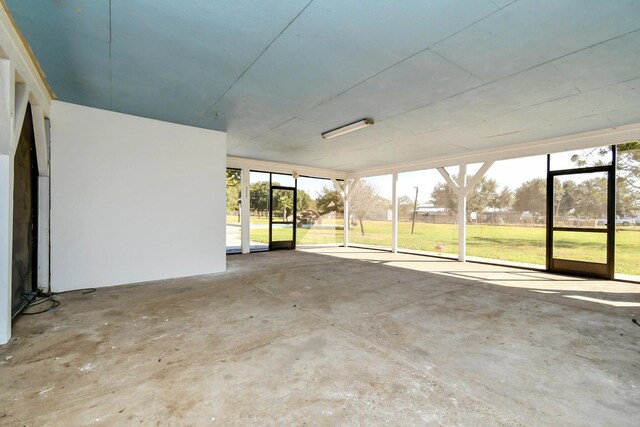 unfurnished sunroom featuring a healthy amount of sunlight