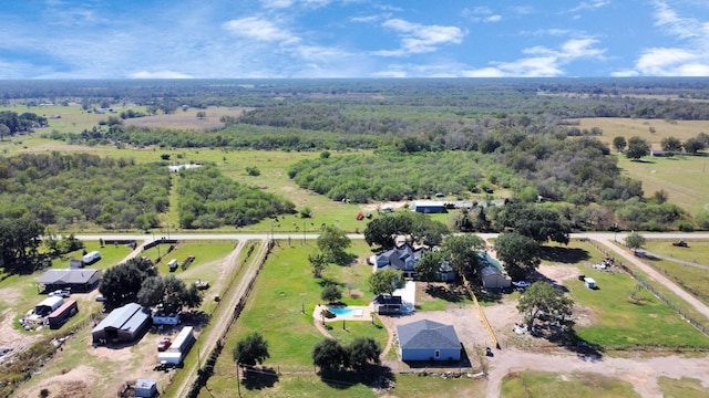 birds eye view of property with a rural view