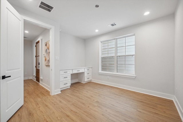 1033 W 17th St, Houston, TX 77008 - unfurnished bedroom with baseboards, light wood finished floors, and recessed lighting