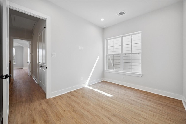 1033 W 17th St, Houston, TX 77008 - unfurnished room with attic access, light wood-style flooring, baseboards, and recessed lighting