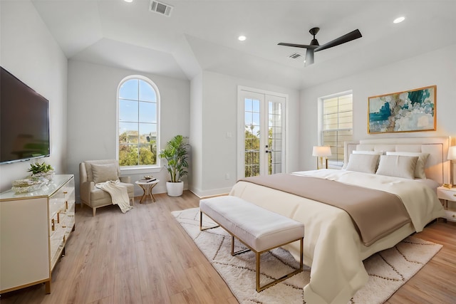 bedroom with access to outside, light hardwood / wood-style flooring, multiple windows, and ceiling fan