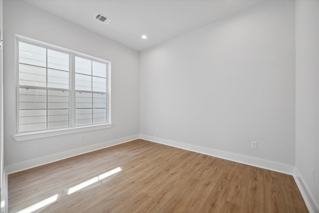 spare room with light wood-type flooring