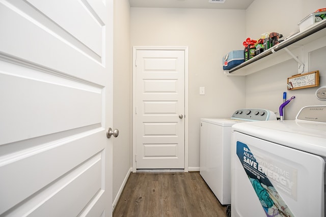 laundry room with dark wood-type flooring and independent washer and dryer