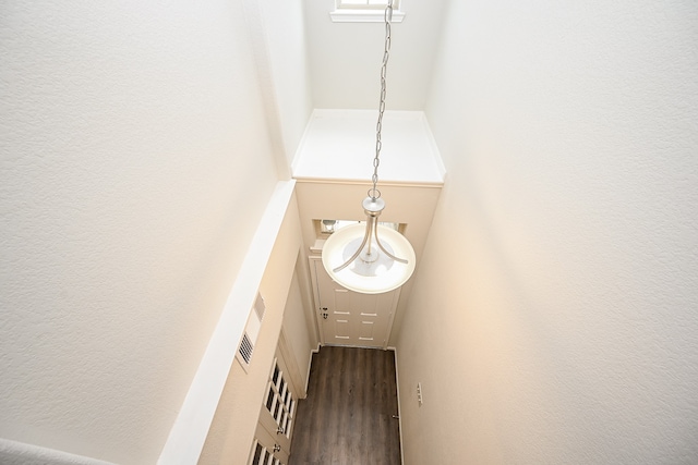 stairway with hardwood / wood-style floors