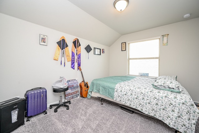 bedroom with carpet and vaulted ceiling