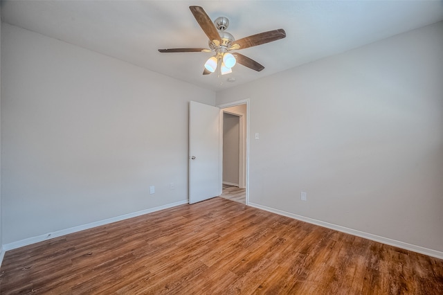 empty room featuring ceiling fan and wood-type flooring