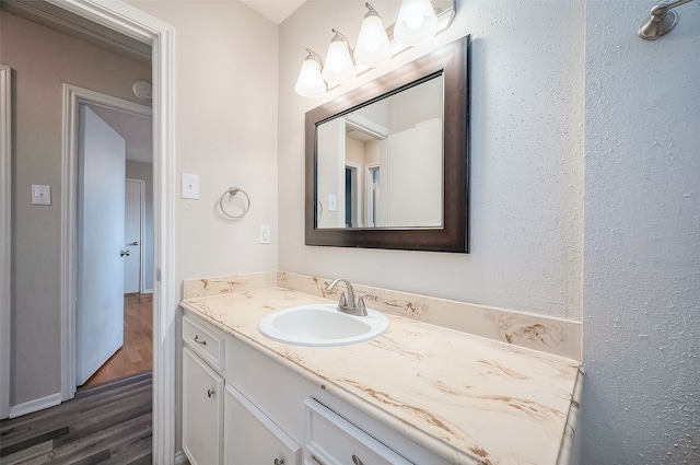 bathroom featuring vanity and hardwood / wood-style flooring