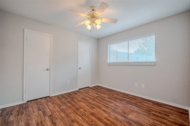 unfurnished bedroom with hardwood / wood-style floors and ceiling fan