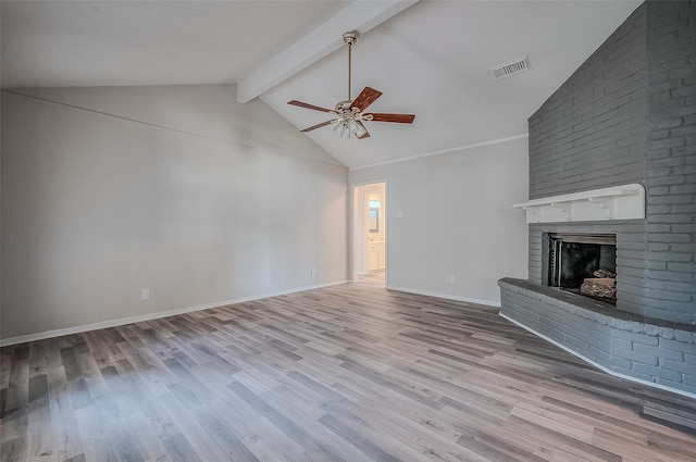 unfurnished living room with vaulted ceiling with beams, ceiling fan, light hardwood / wood-style flooring, and a fireplace