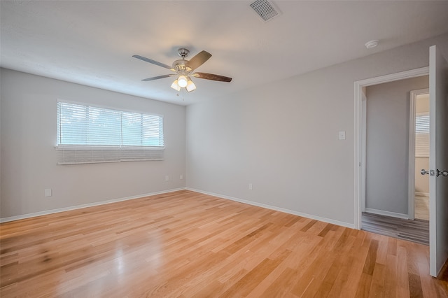 unfurnished room featuring ceiling fan and light wood-type flooring